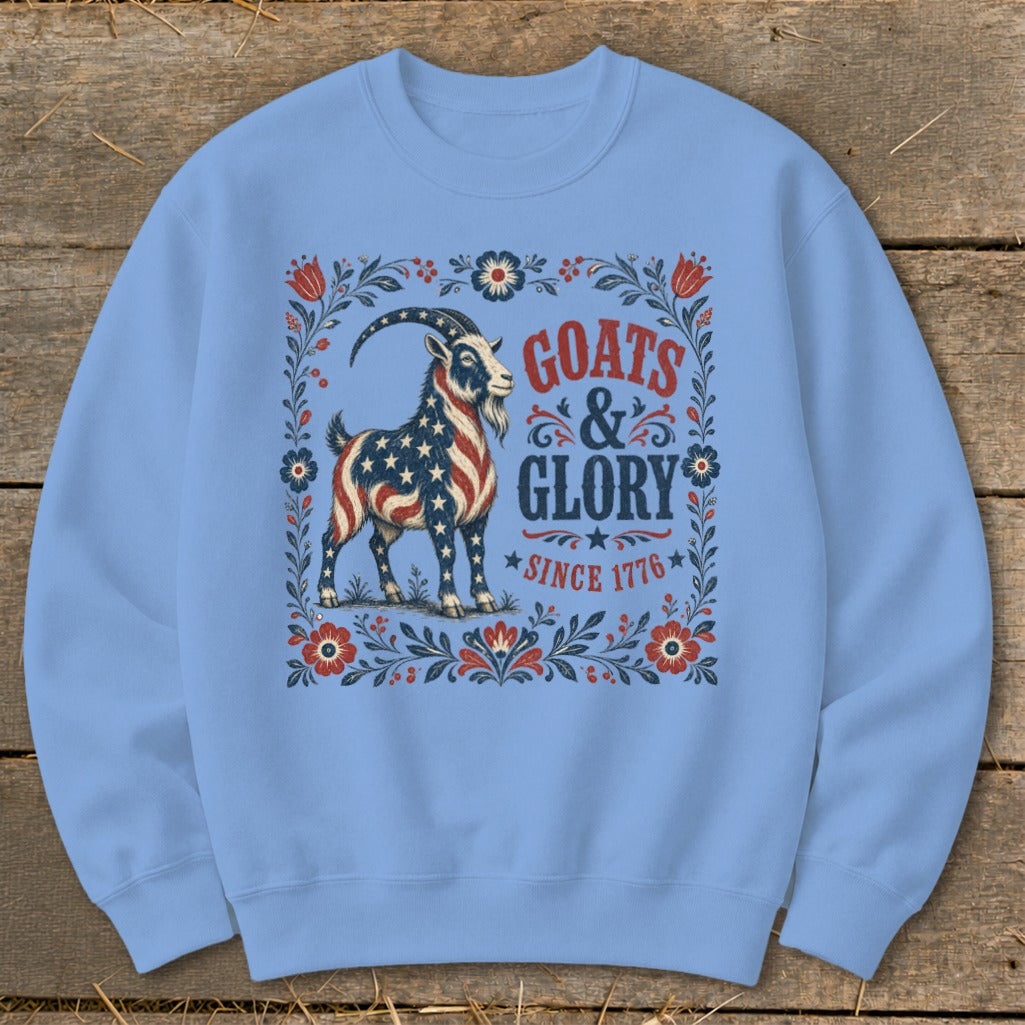 Light blue sweatshirt with patriotic goat graphic and text "Goats & Glory Since 1776".