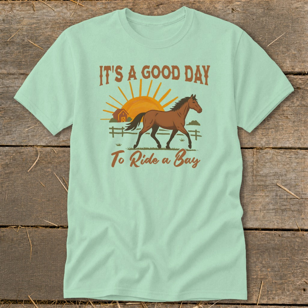 Light blue t-shirt with horse graphic and text "IT'S A GOOD DAY To Ride a Bay".