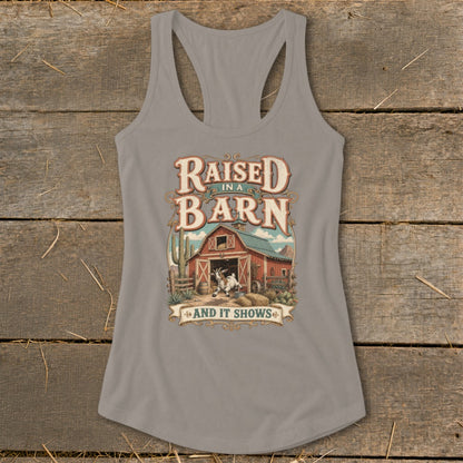 Grey tank top with "Raised in a Barn and It Shows" graphic featuring a goat and barn.
