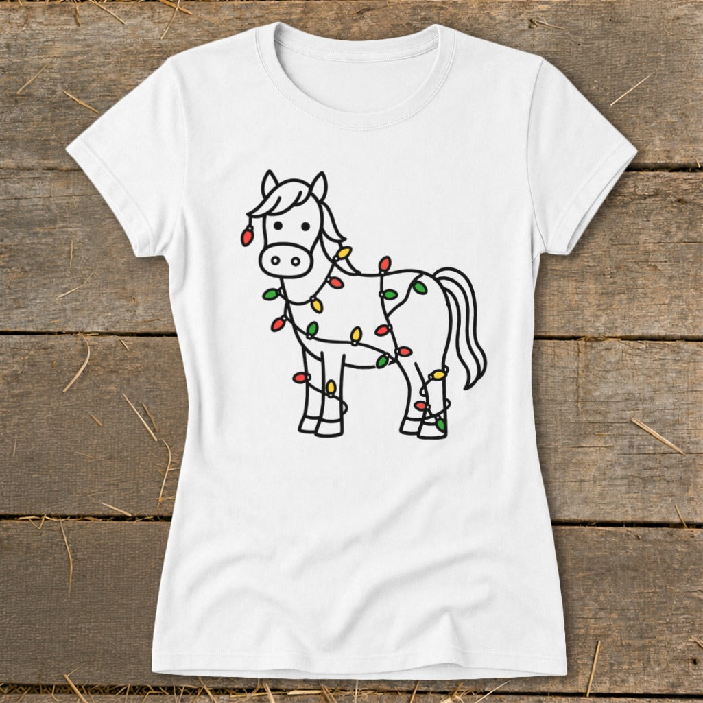 White t-shirt with a black line drawing of a horse tangled in colorful Christmas lights.