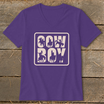 Purple v-neck t-shirt with a white rectangle containing "COW BOY" text and cowboy silhouettes.