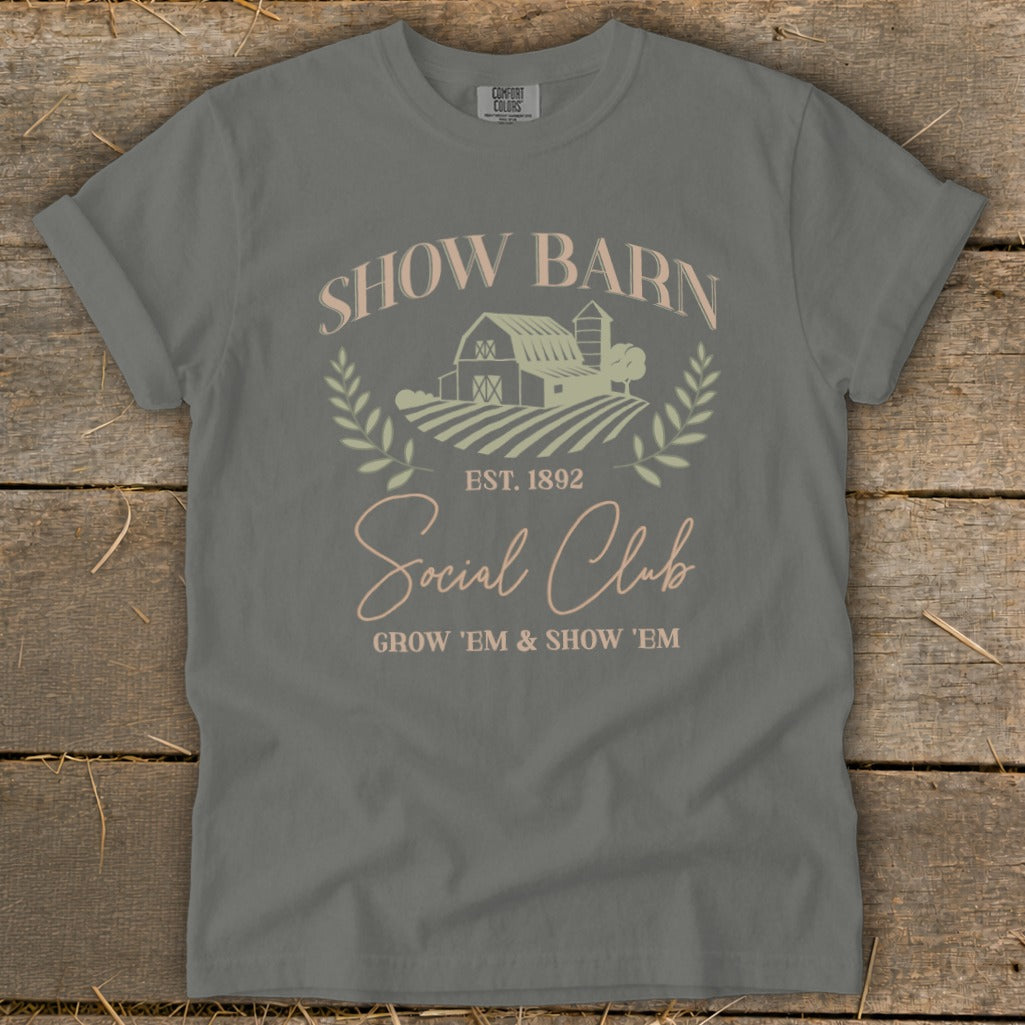 Grey t-shirt with "Show Barn Social Club" text, barn, and crops graphic.