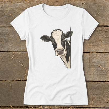White t-shirt with a black and white cow peeking from the side.