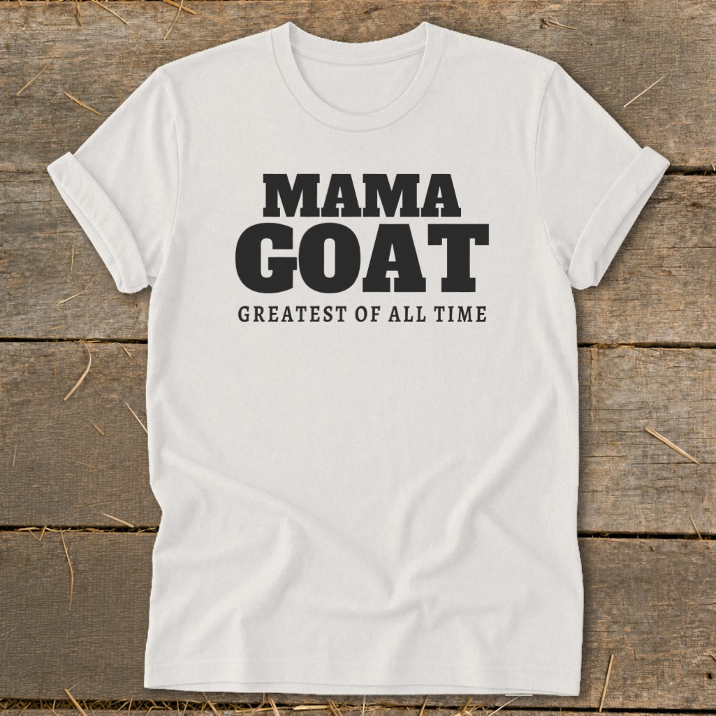 White t-shirt with "MAMA GOAT GREATEST OF ALL TIME" text.