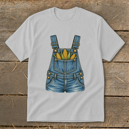 White t-shirt with denim overalls graphic holding three ears of corn.