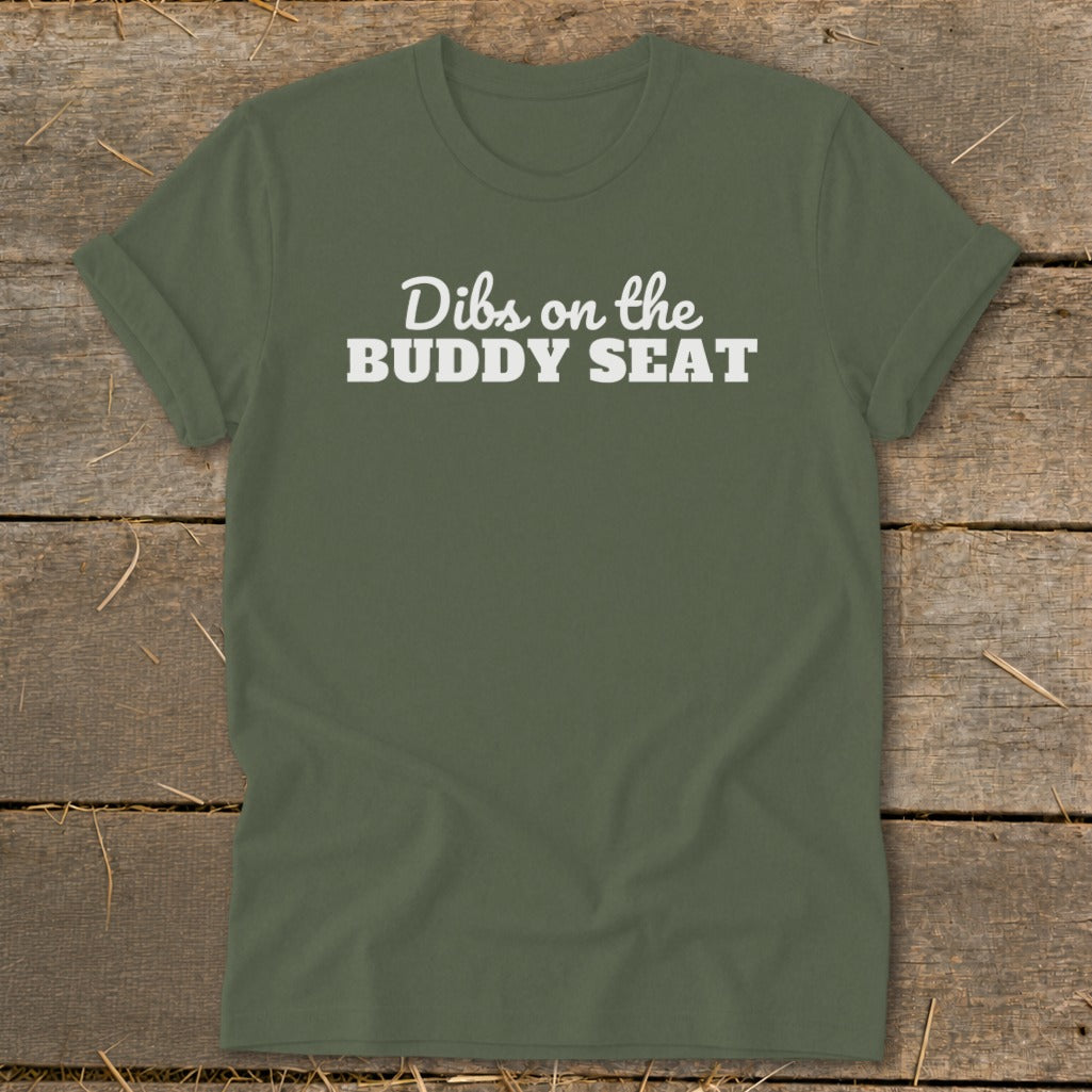 Olive green t-shirt with white text reading "Dibs on the BUDDY SEAT".