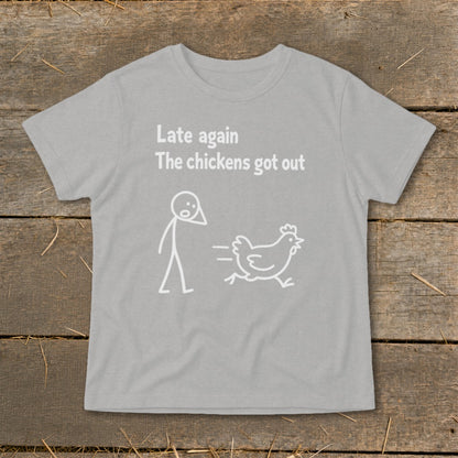 Grey t-shirt with text "Late again The chickens got out" and cartoon stick figure chasing a chicken.