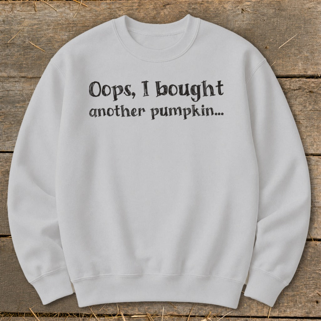 White crewneck sweatshirt with "Oops, I bought another pumpkin..." text.
