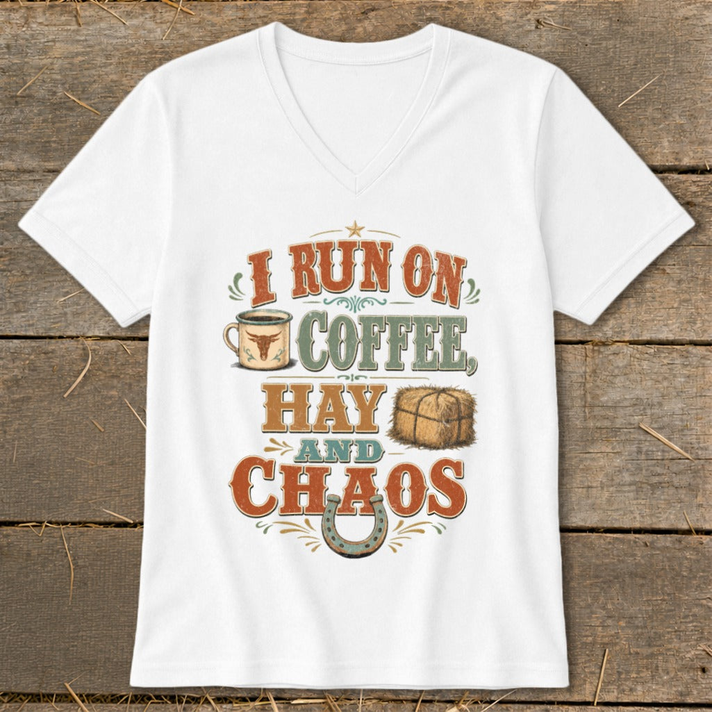 White v-neck t-shirt with "I RUN ON COFFEE, HAY AND CHAOS" graphic.