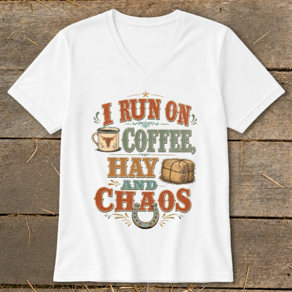 White v-neck t-shirt with "I RUN ON COFFEE, HAY AND CHAOS" graphic.