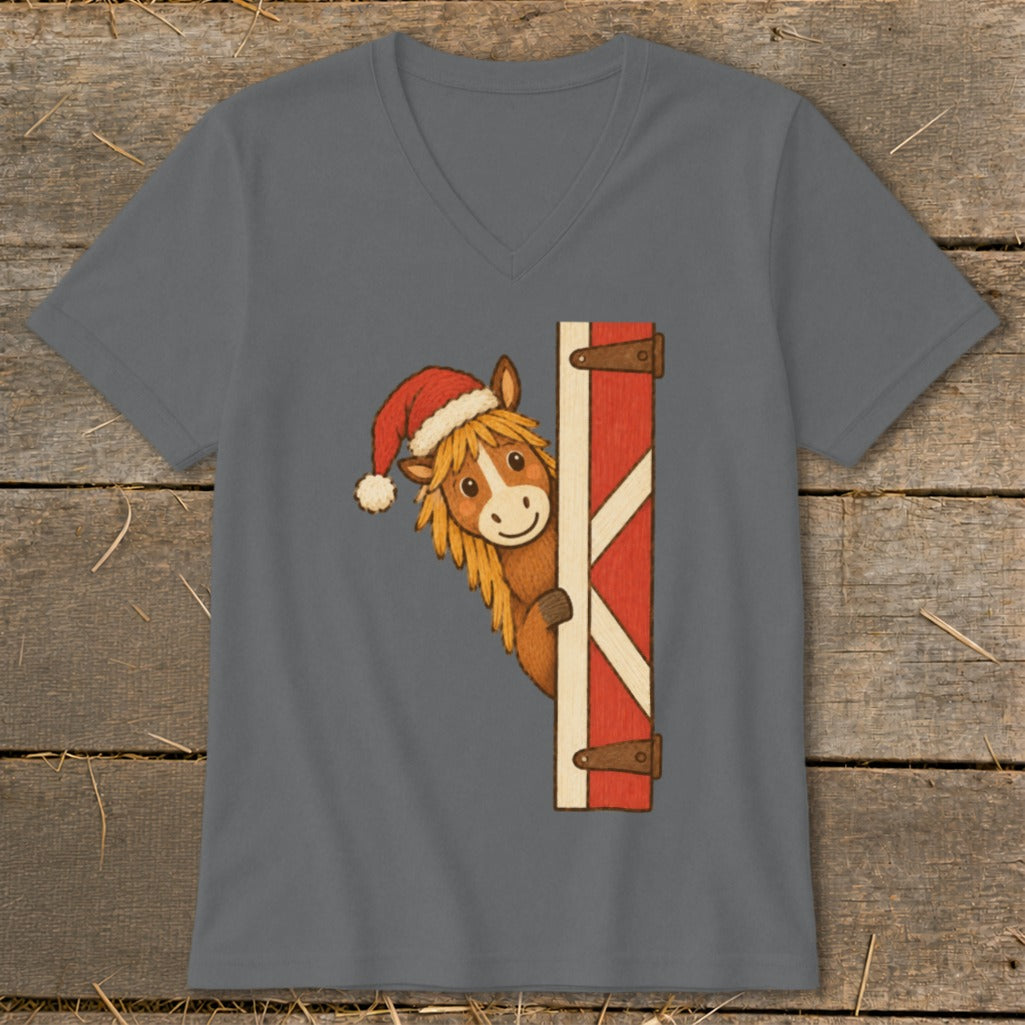 Cartoon horse wearing a Santa hat peeking from behind a red barn door.