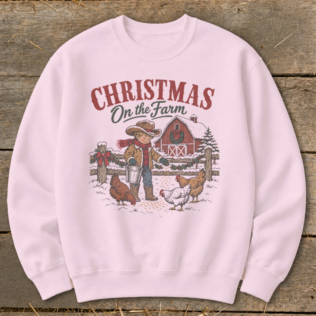 Crewneck sweatshirt with "Christmas On the Farm" text, boy, chickens, and barn graphic.