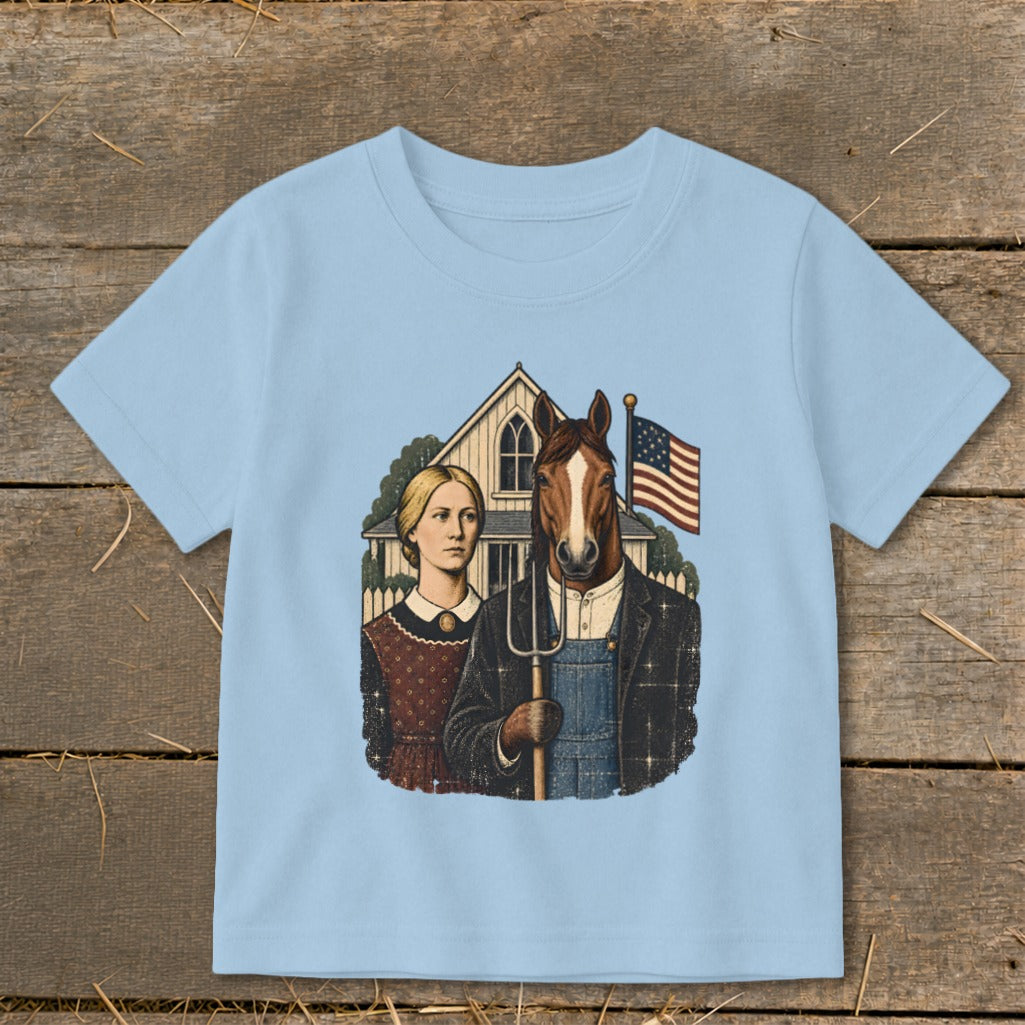 A light blue t-shirt printed with a parody of American Gothic featuring a horse holding a pitchfork.