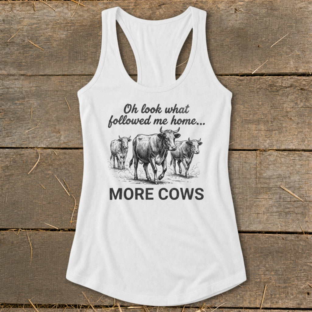 White tank top with three cows and text "Oh look what followed me home... MORE COWS".