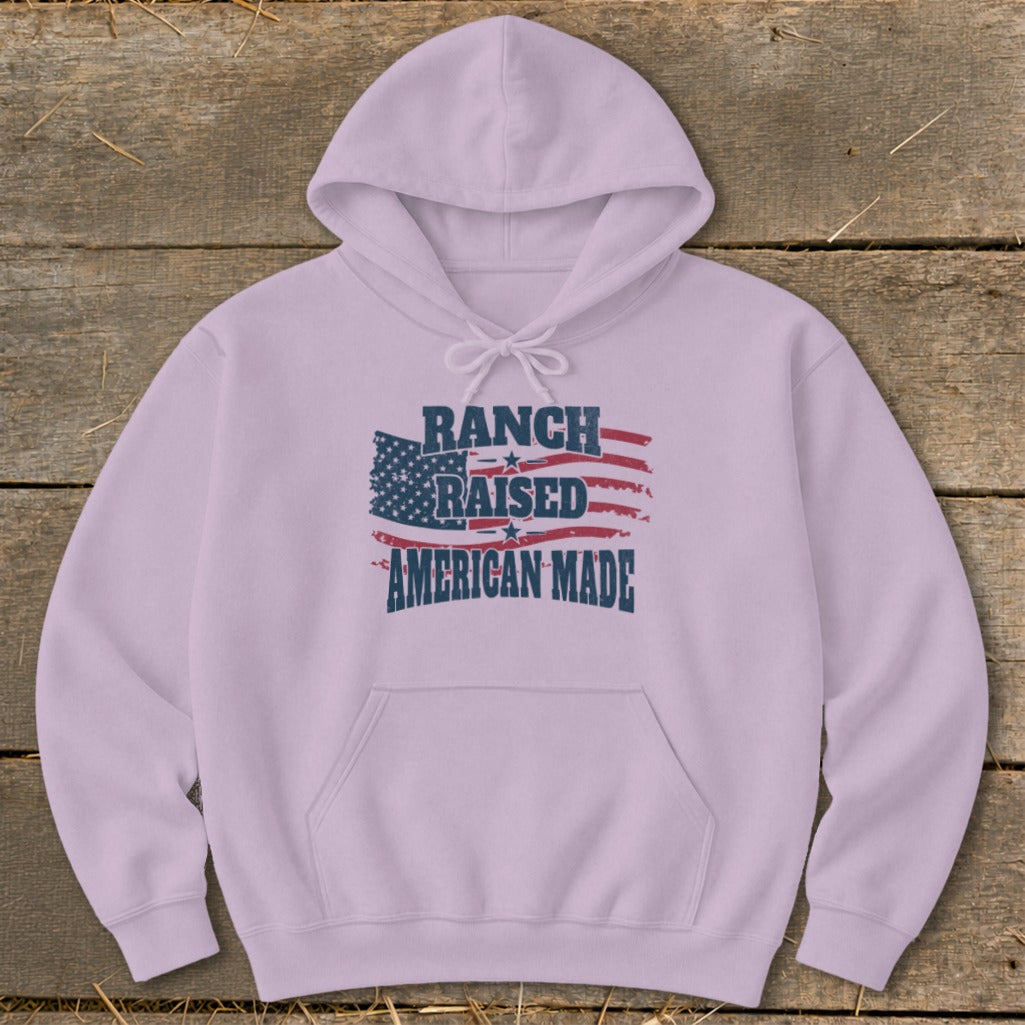 Lilac hoodie with "RANCH RAISED AMERICAN MADE" text and distressed US flag graphic.