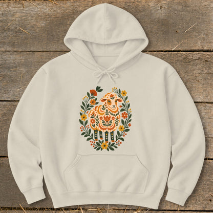 Cream hoodie with a colorful folk art sheep surrounded by flowers.