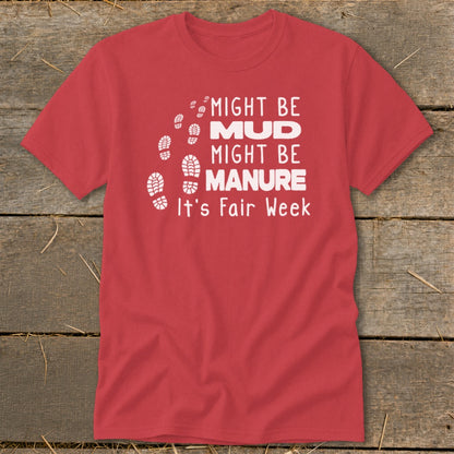 Red t-shirt with "Might Be Mud, Might Be Manure, It's Fair Week" text and footprints.