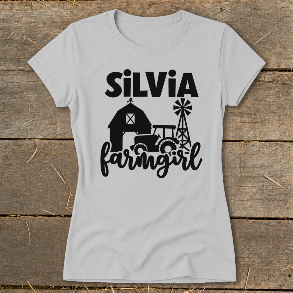Light gray t-shirt with "SiLViA farmgirl" text and barn, tractor, and windmill graphic.