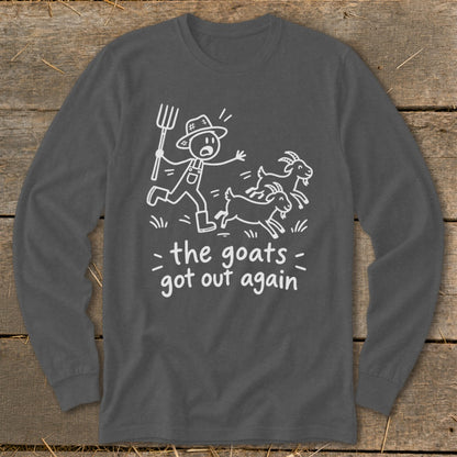 Dark gray long-sleeve shirt with a stick figure farmer chasing goats and the text "the goats got out again".