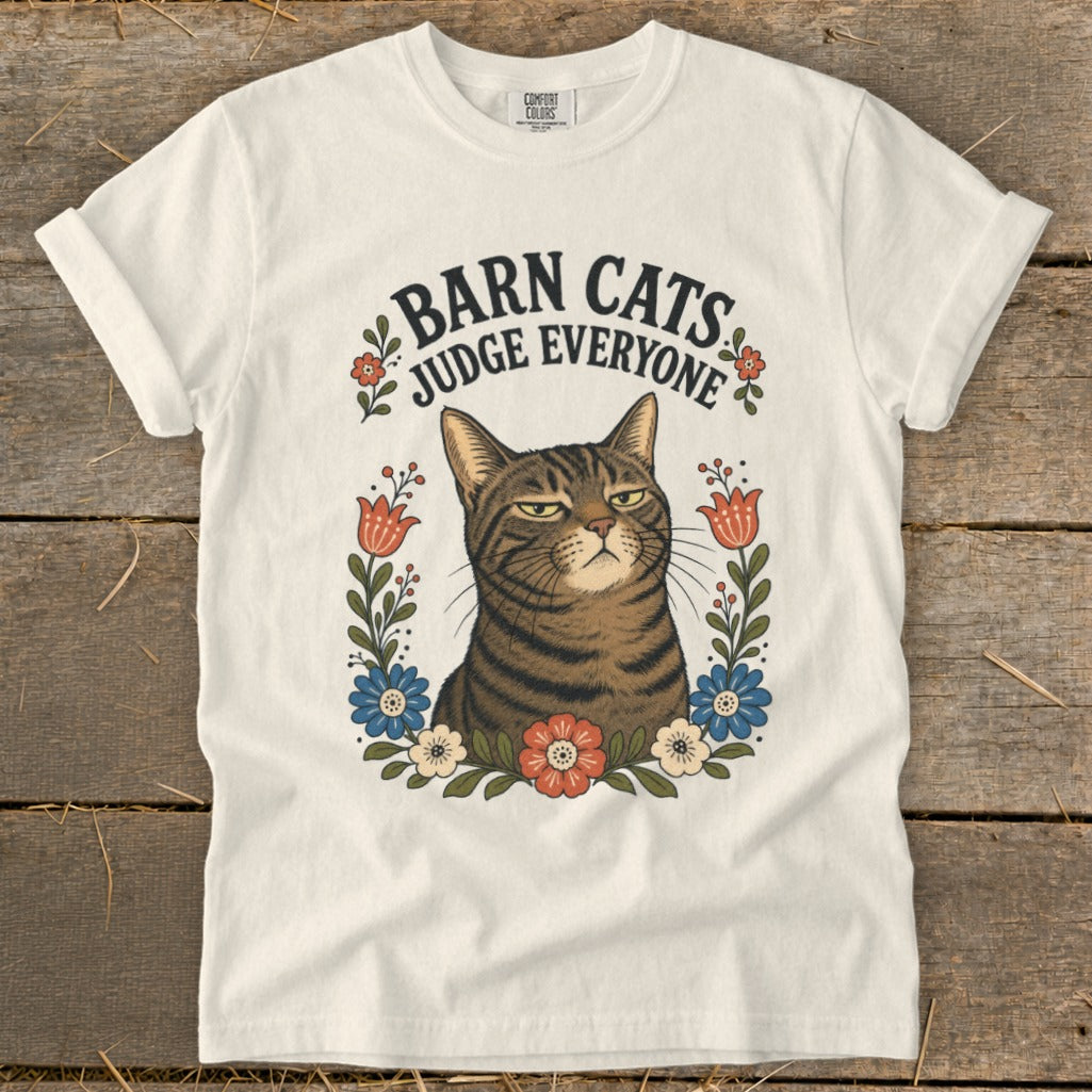 White t-shirt with a cat graphic that says "Barn Cats Judge Everyone".