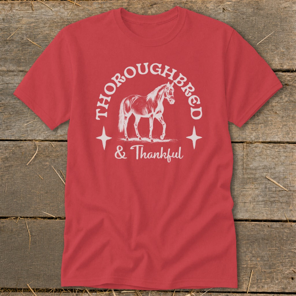 Red t-shirt with white text and horse graphic, reading "Thoroughbred & Thankful".