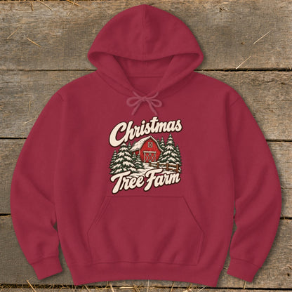 Maroon hoodie with "Christmas Tree Farm" graphic featuring a red barn and pine trees.