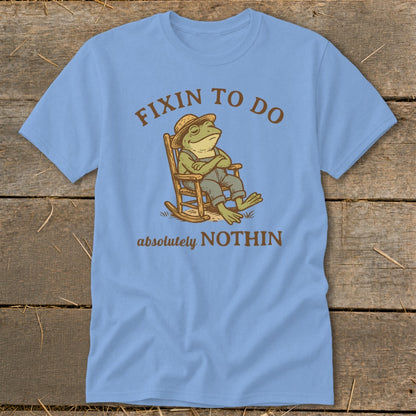 Frog in rocking chair with text "FIXIN TO DO absolutely NOTHIN".
