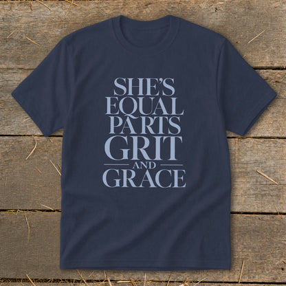 Navy t-shirt with light blue text: "She's equal parts grit and grace."