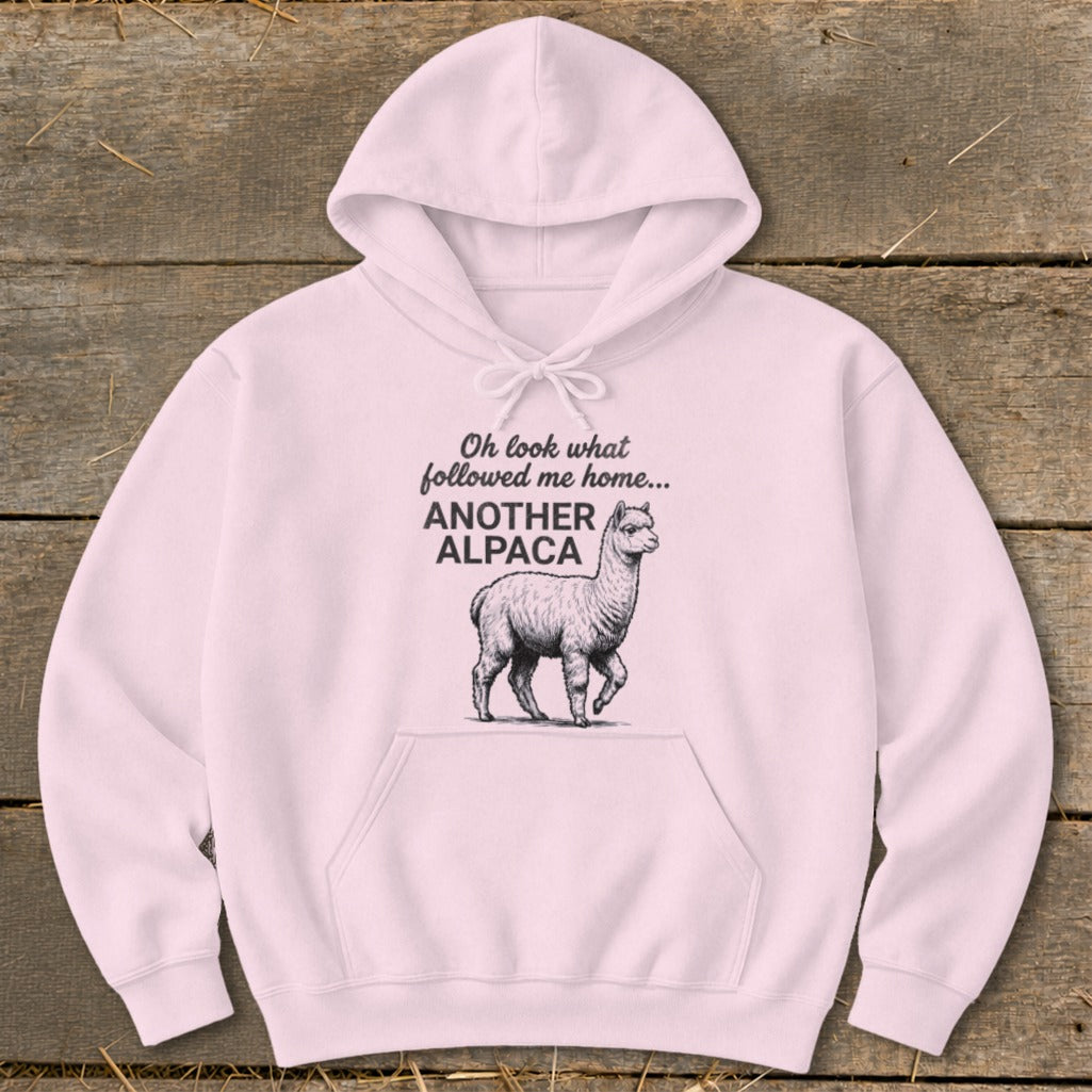 Pink hoodie with "Oh look what followed me home... ANOTHER ALPACA" text and alpaca graphic.