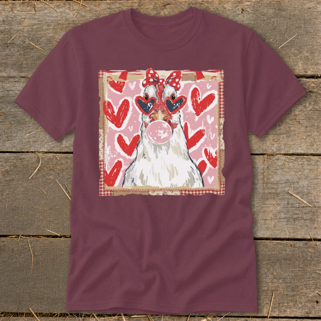Chicken with heart sunglasses blowing bubblegum, on a pink heart background.