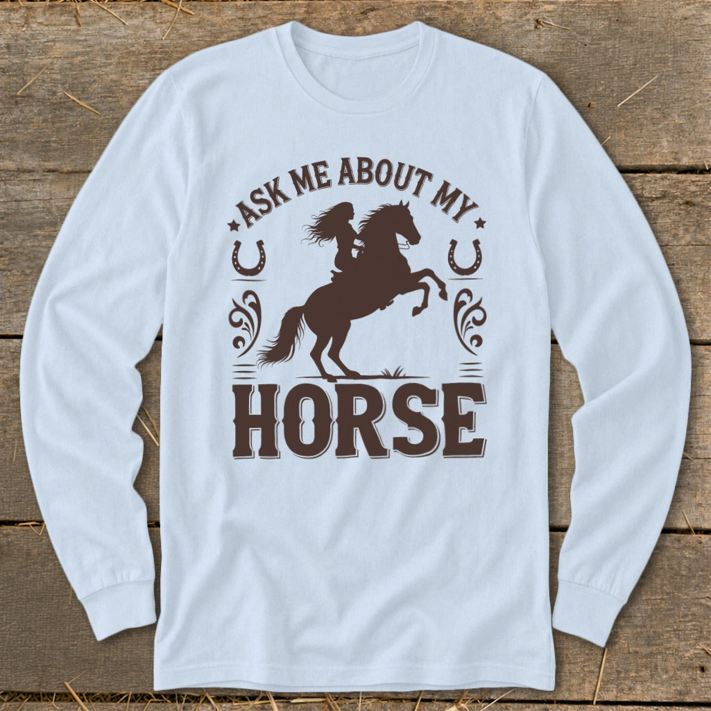 Long sleeve shirt with brown graphic of a rider on a rearing horse and text.