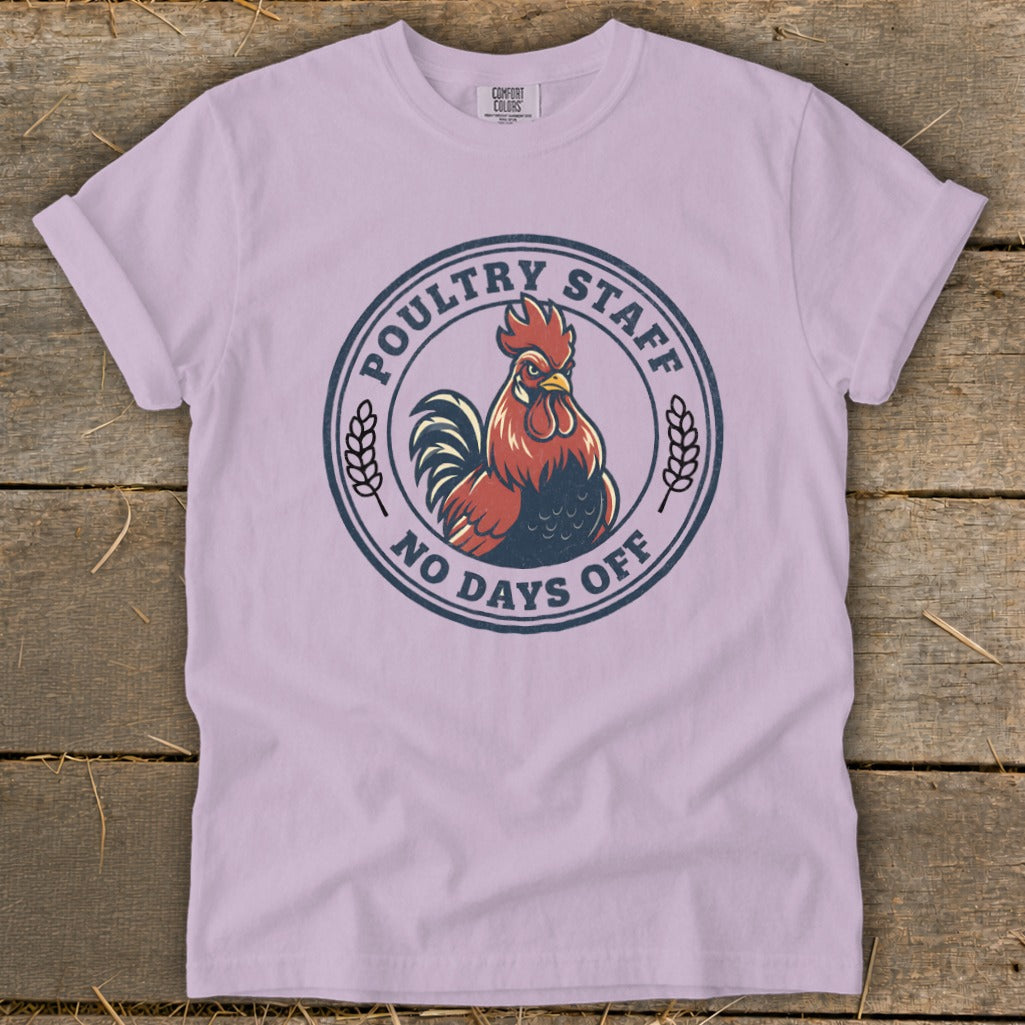 Light purple t-shirt with a circular graphic featuring a rooster and text that reads "Poultry Staff No Days Off".