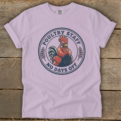 Light purple t-shirt with a circular graphic featuring a rooster and text that reads "Poultry Staff No Days Off".