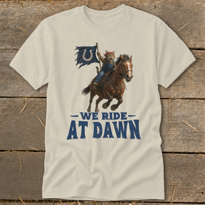 Cat wearing bandana rides horse, holds torn flag with horseshoe logo. Text reads: We Ride at Dawn.