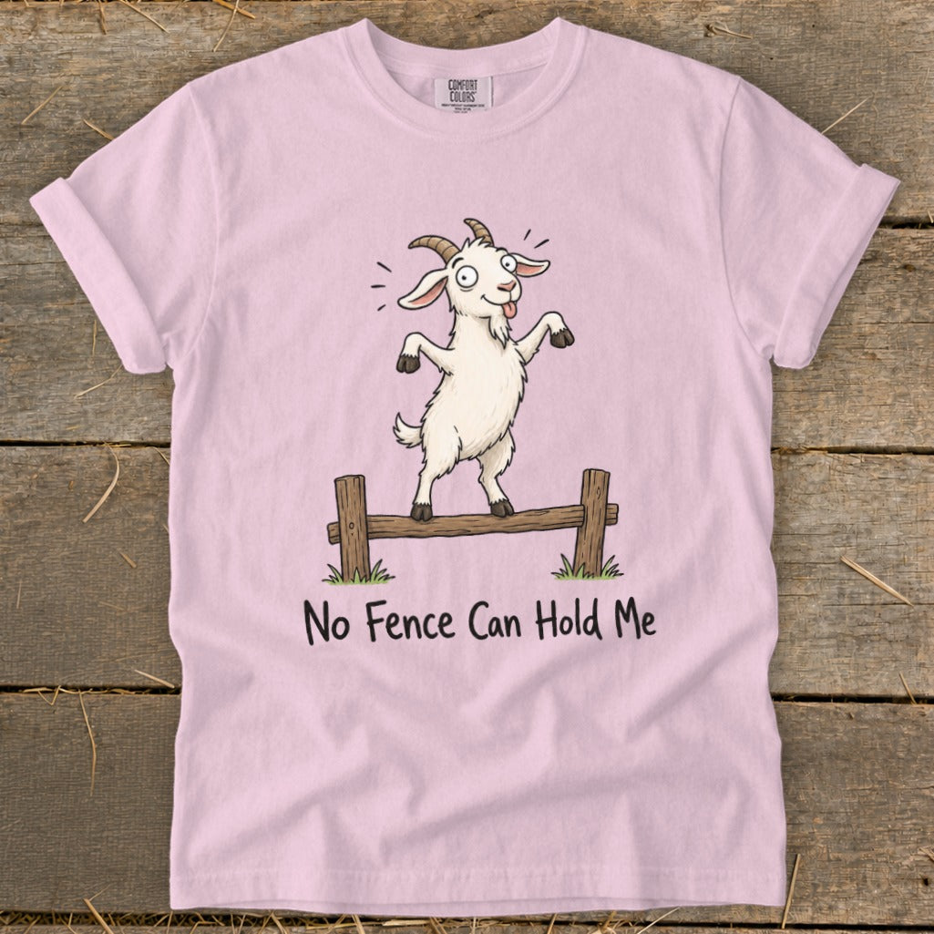 Pink t-shirt with a cartoon goat balanced on a fence with text "No Fence Can Hold Me".