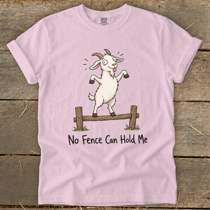 Pink t-shirt with a cartoon goat balanced on a fence with text "No Fence Can Hold Me".