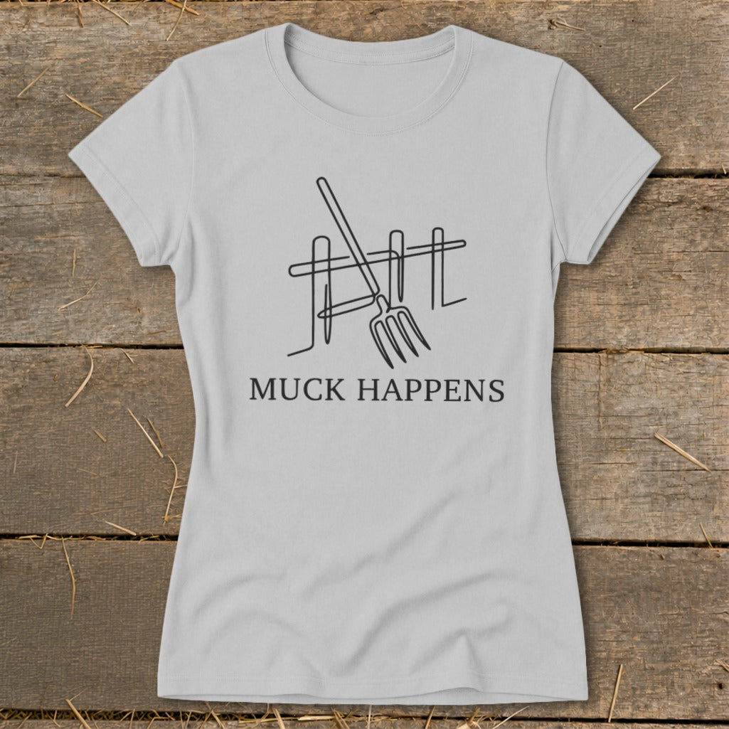 Light gray t-shirt with a black line drawing of a pitchfork and fence, and text that reads "MUCK HAPPENS".