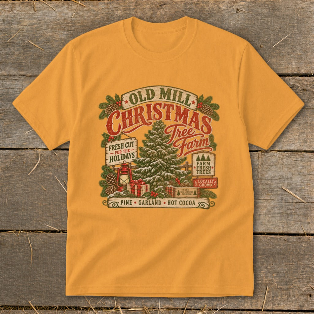 Mustard yellow crewneck t-shirt featuring a vintage Old Mill Christmas Tree Farm graphic with pinecones and a lantern.