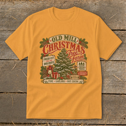 Mustard yellow crewneck t-shirt featuring a vintage Old Mill Christmas Tree Farm graphic with pinecones and a lantern.