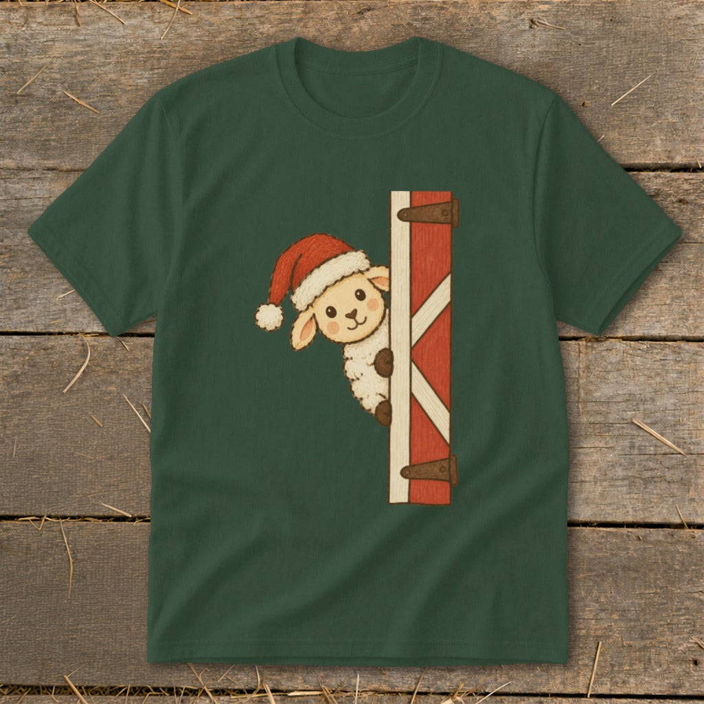 Sheep in Santa hat peeking around a barn door graphic on a dark green t-shirt.