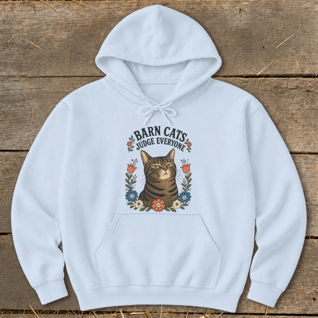 Light blue hoodie with a brown tabby cat, flowers, and text "BARN CATS JUDGE EVERYONE".