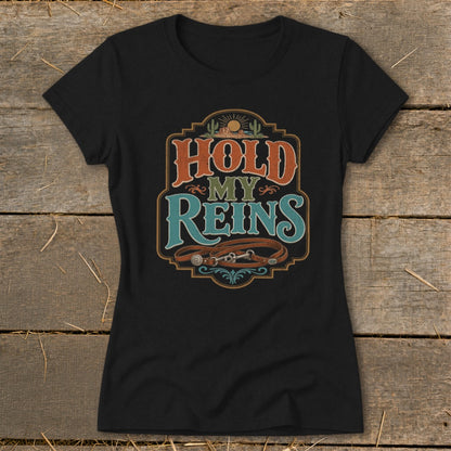 Black t-shirt featuring "Hold My Reins" text with horse reins and desert scene.