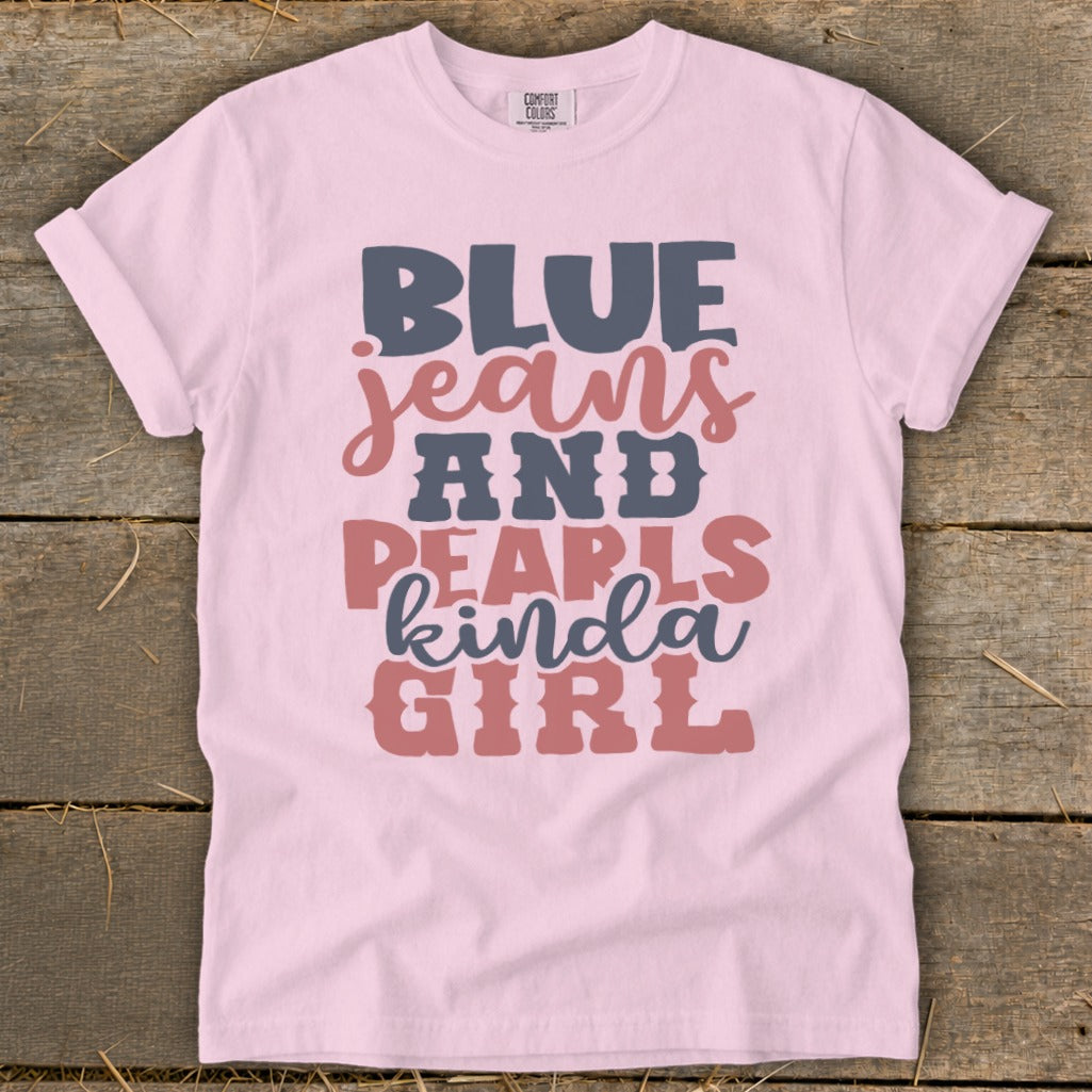 Pink t-shirt with blue jeans and pearls kinda girl graphic.