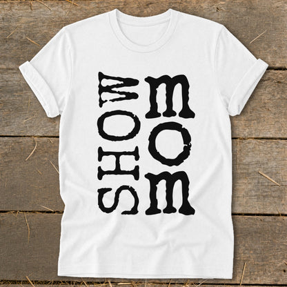 White t-shirt with black block lettering spelling "MOM" vertically on the right and "SHOW" vertically on the left.