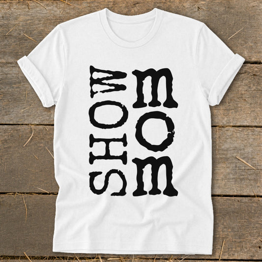 White t-shirt with black block lettering spelling "MOM" vertically on the right and "SHOW" vertically on the left.