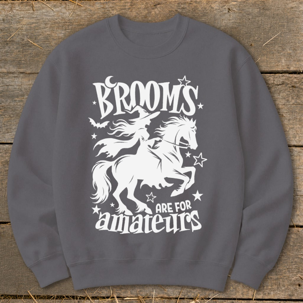 White witch on horse design with "Brooms are for amateurs" text.
