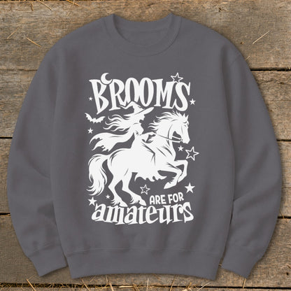 White witch on horse design with "Brooms are for amateurs" text.