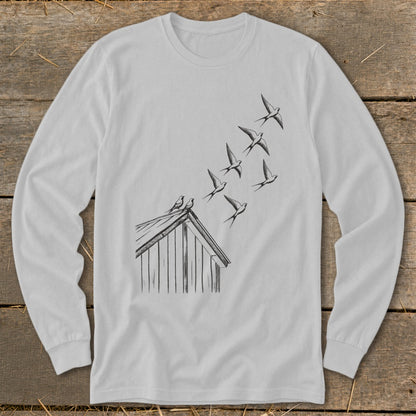 Light gray long-sleeve t-shirt featuring a line drawing of birds flying from a rooftop.