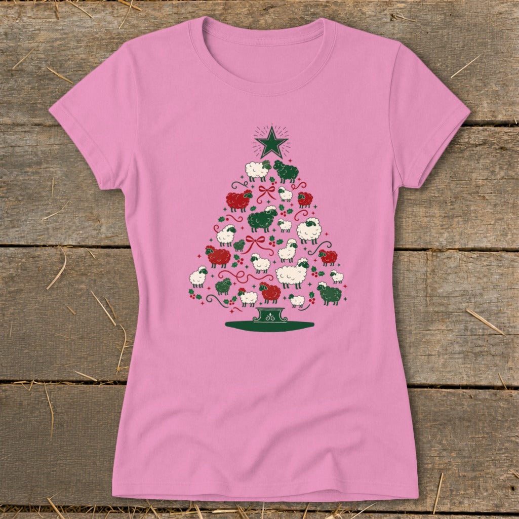 Pink t-shirt with a Christmas tree made of red, green, and white sheep.