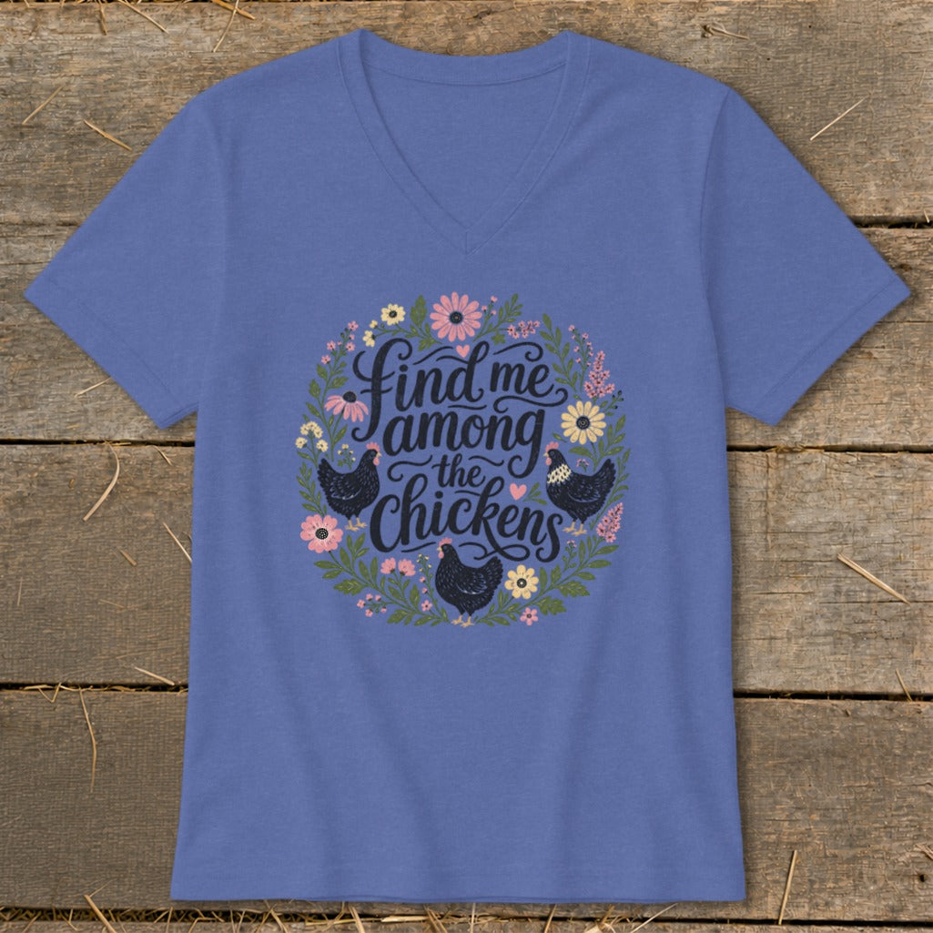 Purple v-neck shirt with a circular floral design and chickens, reading "find me among the chickens".